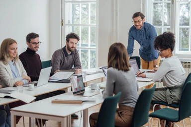 Six people in a business meeting.
