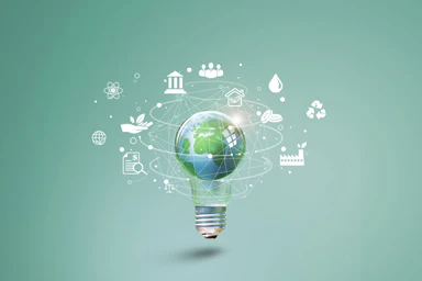 A light bulb and a globe surrounded by ecological pictograms.