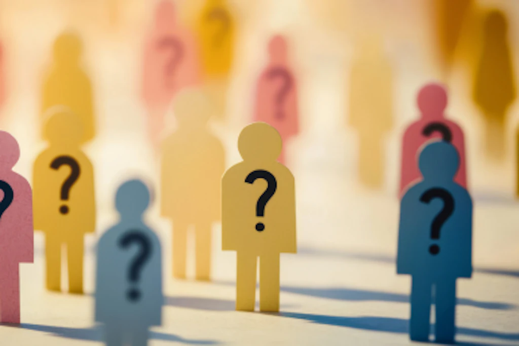 Colored figures standing with question marks on their stomachs.