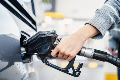 Filling a petrol tank.